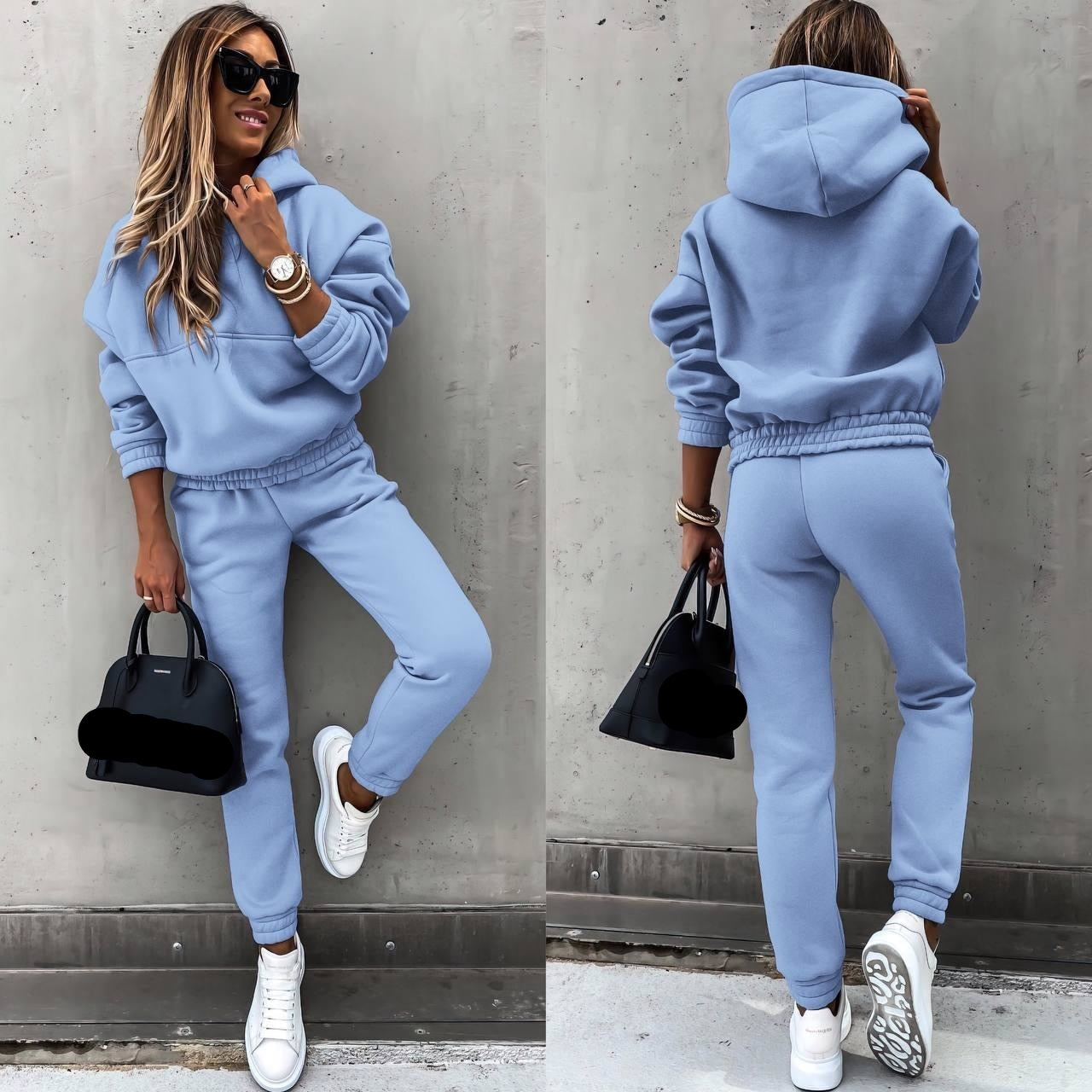 Boreza Joggingset (Trendy) Deze trendy joggingset biedt ultiem comfort en stijl. De lichtblauwe kleur en het relaxte design maken het de perfecte outfit voor een casual dag. Het is een ideale keuze voor zowel thuis als onderweg, met een modieuze uitstraling die niet in de weg zit van comfort. Combineer de set met een stijlvolle tas voor een complete look.