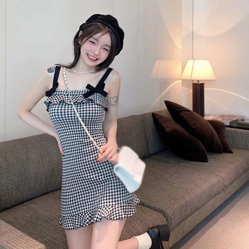 ModeWhisperer Plaid Halter Dress - Confident Elegance for Every Occasion!