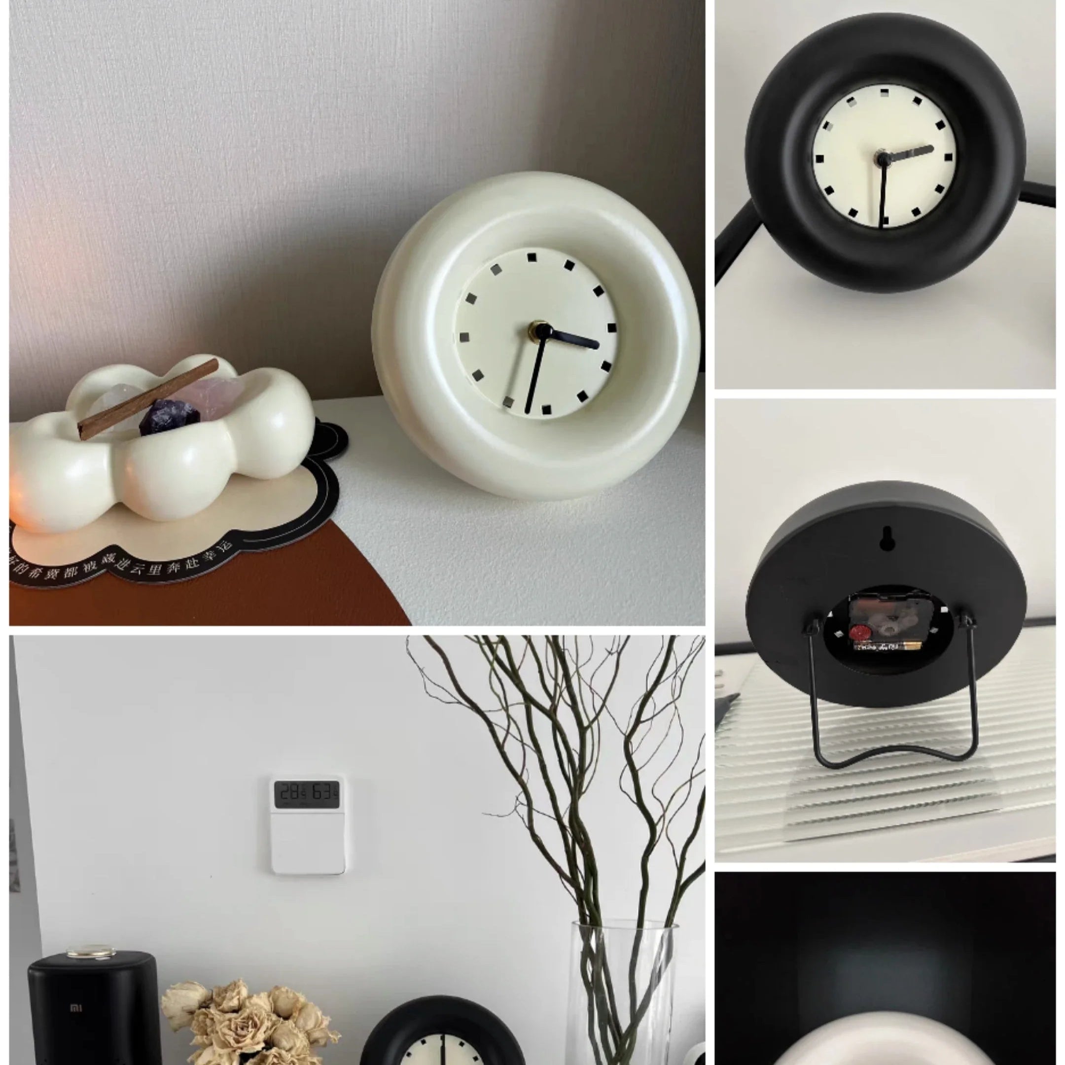 Elekta alarmklok in zwart en wit met een strak, minimalistisch ontwerp. De klok heeft een eenvoudige wijzerplaat met zwarte markeringen en past perfect in een modern interieur. De foto toont verschillende hoeken van de klok, waaronder de achterkant en details van het ontwerp.