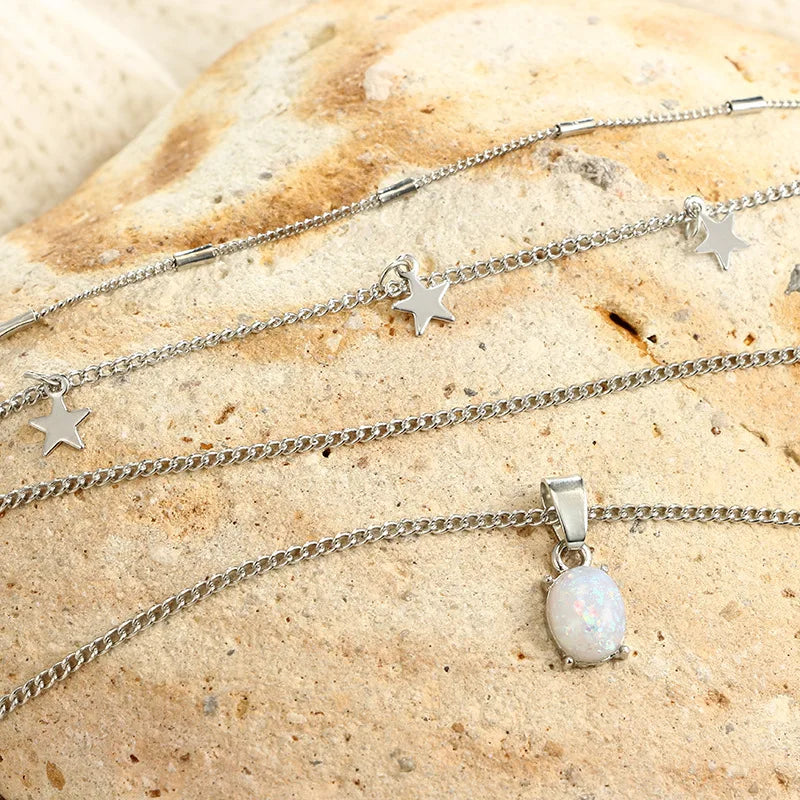 Betoverende Bohemian Glow Multilaagse Ketting met Kristallen Pentagrammen