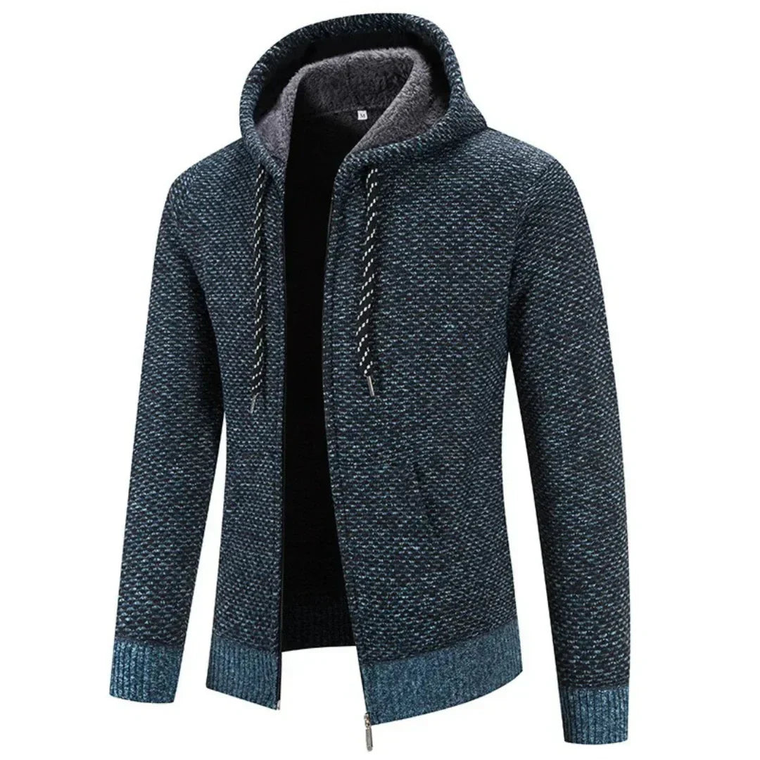 Faloro stijlvolle hoodie in donkerblauw met een warme voering en capuchon. De hoodie heeft een ritssluiting, geribbelde boorden en een subtiel geweven patroon. Ideaal voor casual gebruik in de herfst en winter, en biedt zowel comfort als warmte.