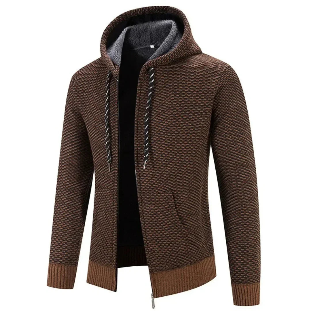 Faloro stijlvolle hoodie in bruin met een warme voering en capuchon. De hoodie heeft een ritssluiting, geribbelde boorden en een subtiel geweven patroon. Perfect voor casual gebruik tijdens koude dagen, biedt comfort en een trendy uitstraling.