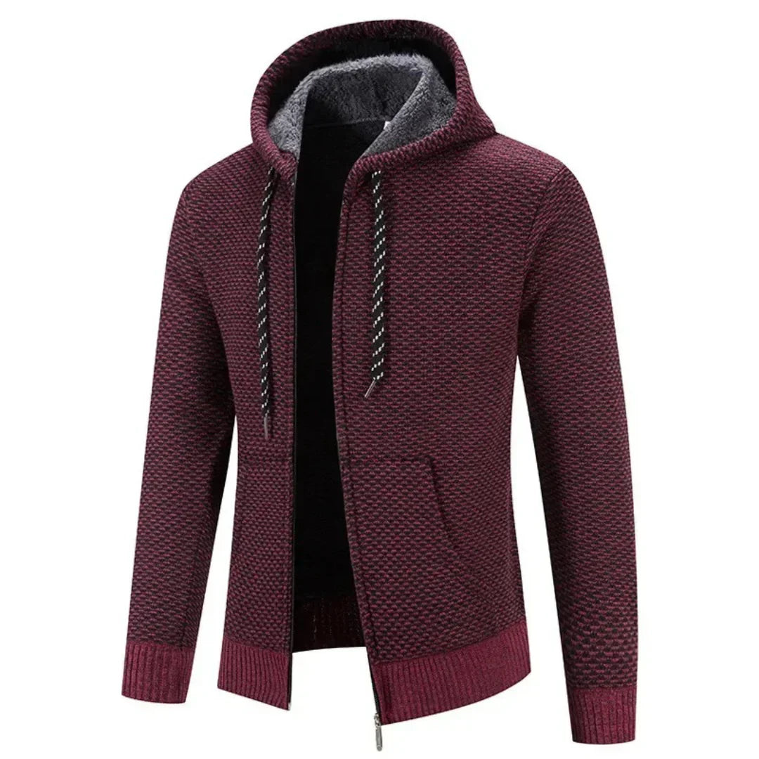 Faloro stijlvolle hoodie in bordeauxrood met warme voering en capuchon. De hoodie heeft een ritssluiting, geribbelde boorden en een subtiel geweven patroon. Ideaal voor casual gebruik tijdens koudere dagen, biedt comfort en een trendy uitstraling.