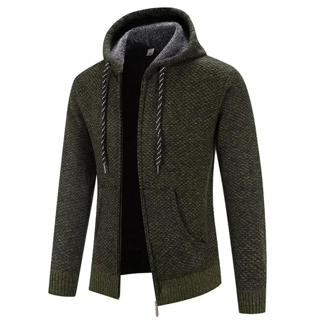 Faloro stijlvolle hoodie in donkergroen met een warme voering en capuchon. De hoodie heeft een moderne ritssluiting, geribbelde boorden en een strak design. Perfect voor casual en comfortabele outfits in het najaar en de winter.