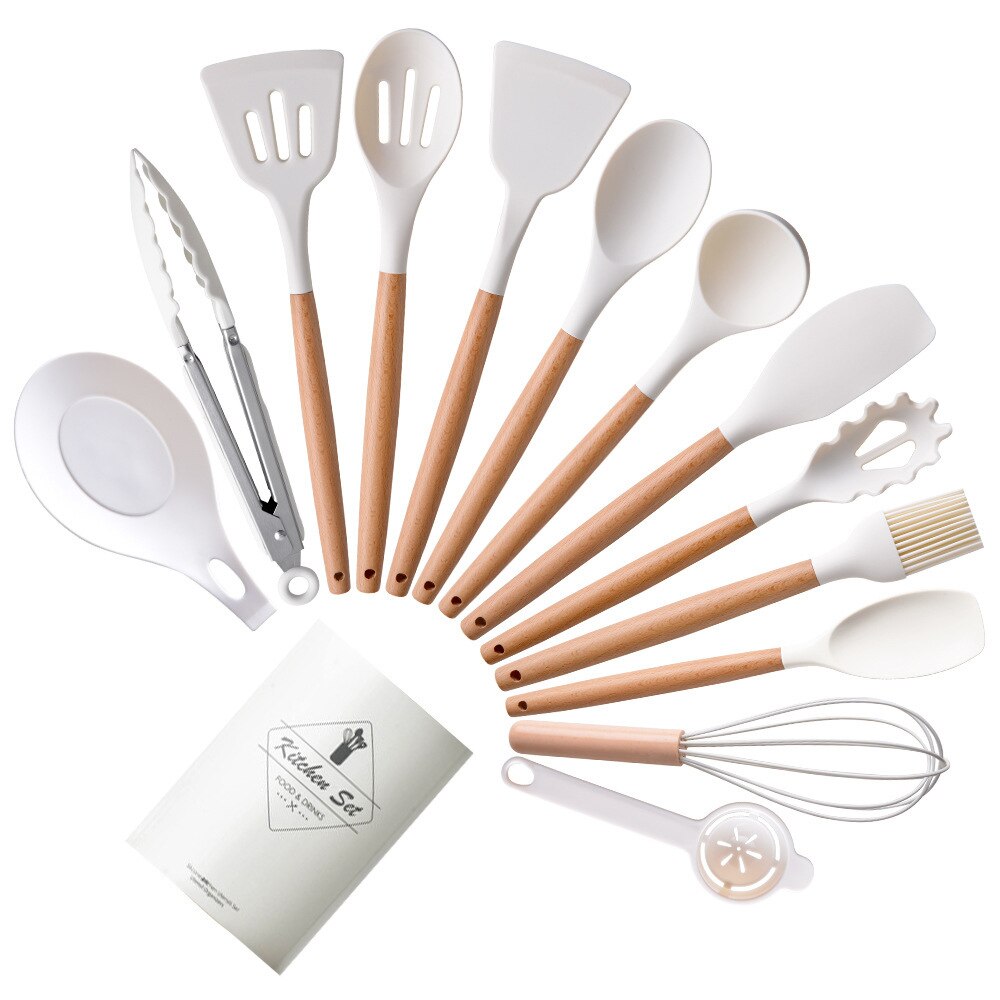 Complete Gavernix keukenset met houten handvatten en witte siliconen koppen. De set bevat diverse spatels, lepels, een garde, tangen en een kwast. Elegant en functioneel voor elke keuken.