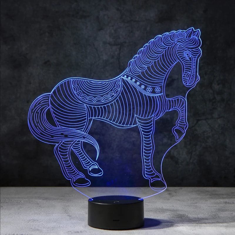 Een 3D-nachtlamp in de vorm van een paard, dat in rustgevend blauw licht straalt. Deze unieke lamp zorgt voor een ontspannende en stijlvolle sfeer en is een ideaal decoratiestuk voor elke kamer die elegantie en rust uitstraalt.