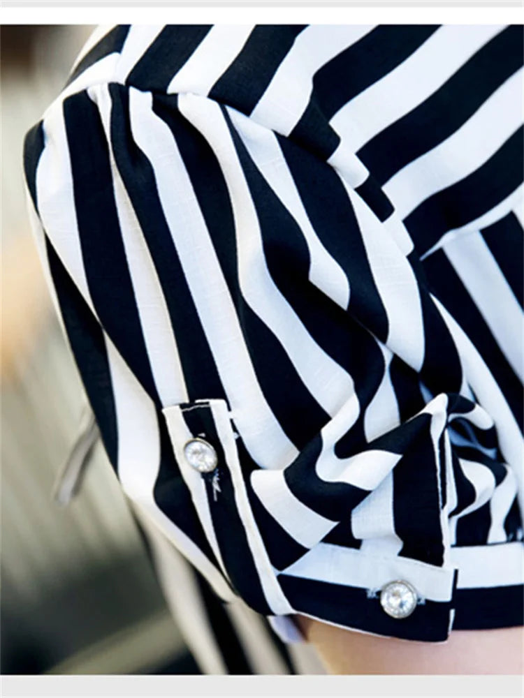 Blusa lunga in chiffon con righe e cintura