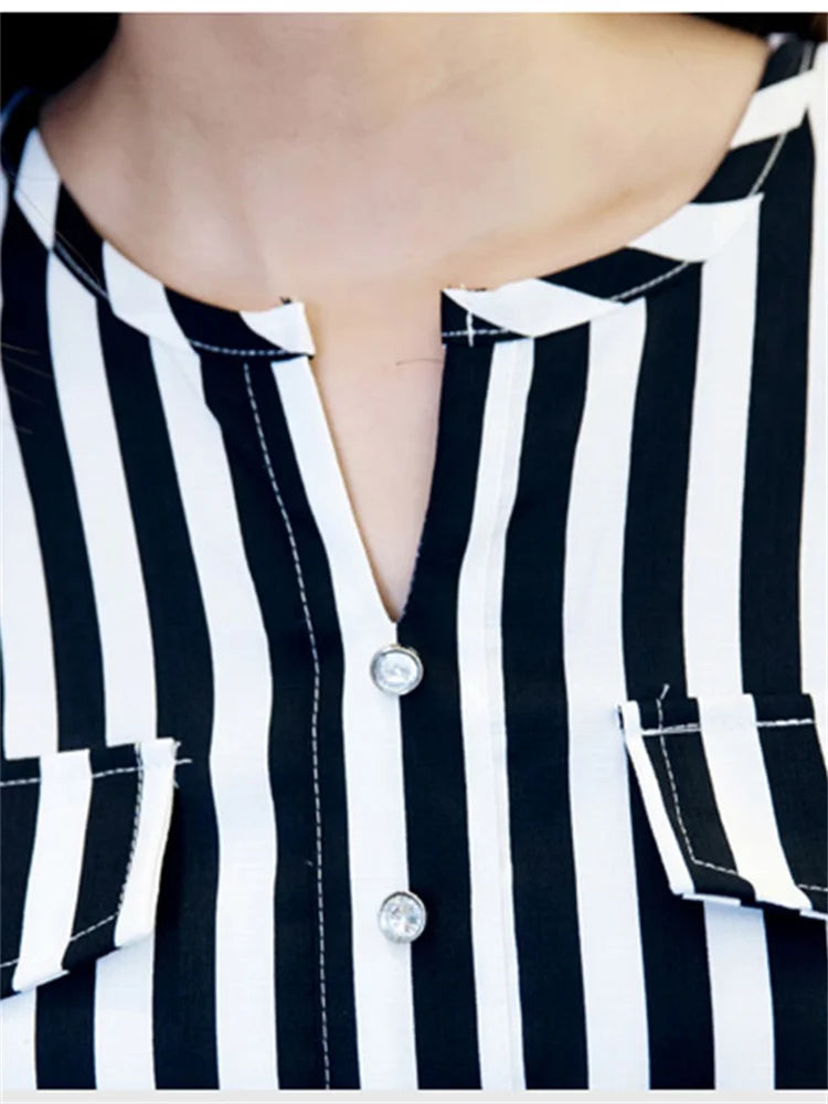 Blusa lunga in chiffon con righe e cintura