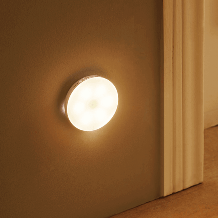 The LumoGlow Motion Lamp, installed on a wall, offers automatic, energy-efficient lighting that activates with movement. Its slim design is perfect for guiding you through dark hallways or entryways while maintaining a discreet and stylish presence.