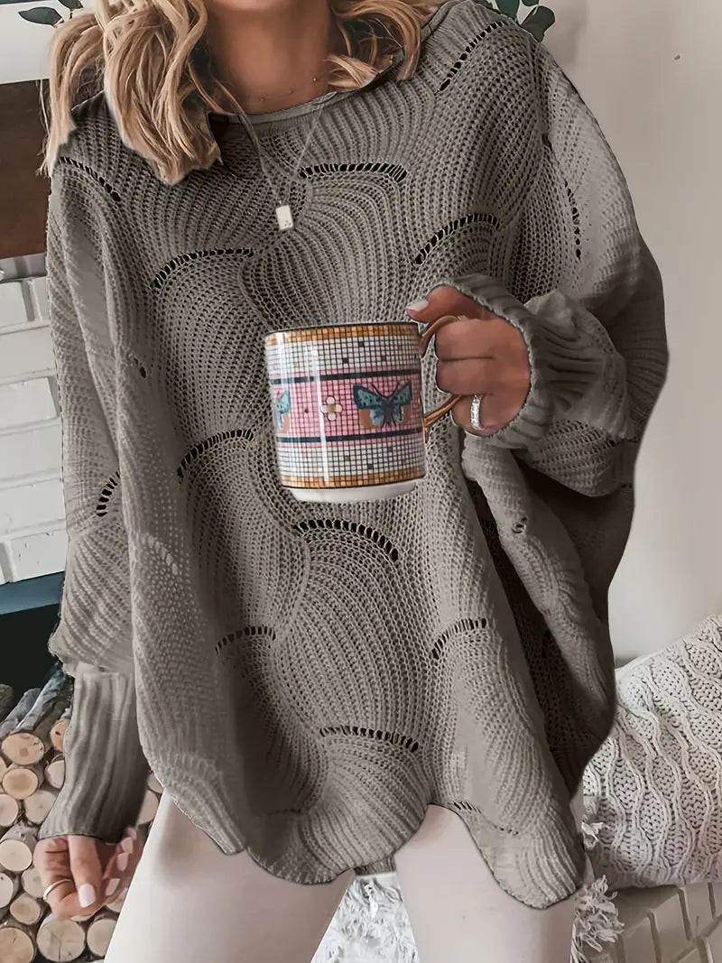 Merina stijlvolle oversized trui in taupe met een golvend breipatroon. De trui heeft een losse pasvorm, lange mouwen en een comfortabele, casual uitstraling. Perfect voor een gezellige en trendy look.