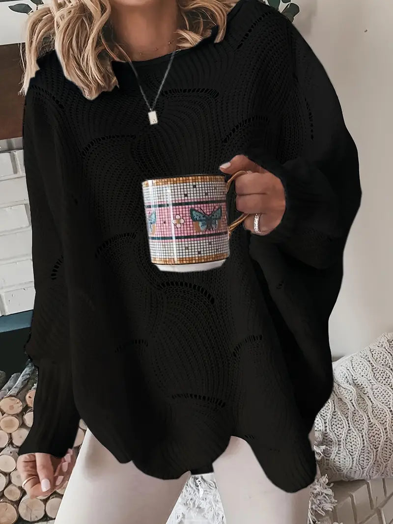 Merina stijlvolle oversized trui in zwart met een golvend breipatroon. De trui heeft een comfortabele losse pasvorm, lange mouwen en een moderne uitstraling. Perfect voor een casual en elegante look.