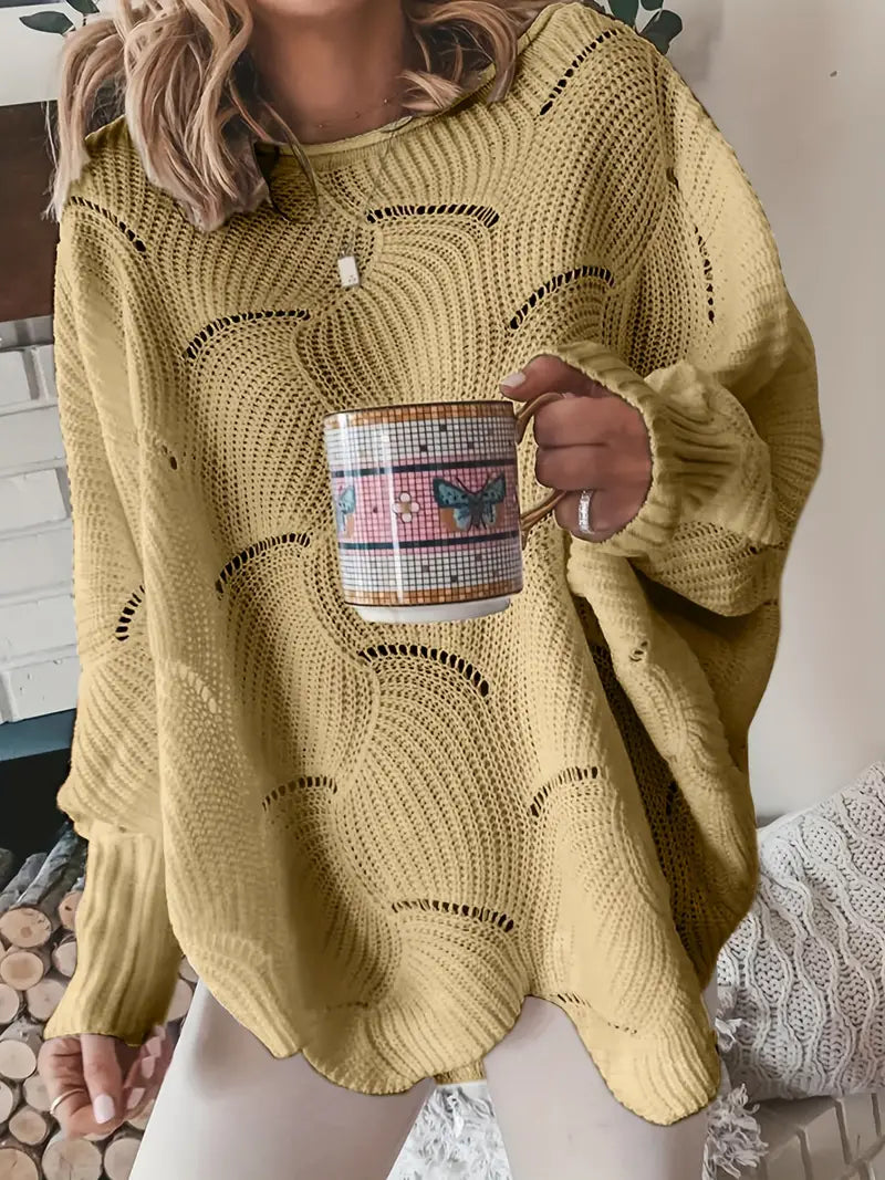 Merina stijlvolle oversized trui in mosterdgeel met een golvend breipatroon. De trui heeft een comfortabele losse pasvorm, lange mouwen en een moderne uitstraling. Perfect voor een casual en elegante look.