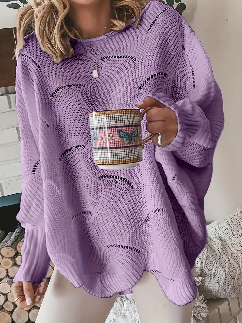 Merina stijlvolle oversized trui in lila met een golvend breipatroon. De trui heeft een comfortabele losse pasvorm, lange mouwen en een moderne uitstraling. Ideaal voor een casual en trendy look.