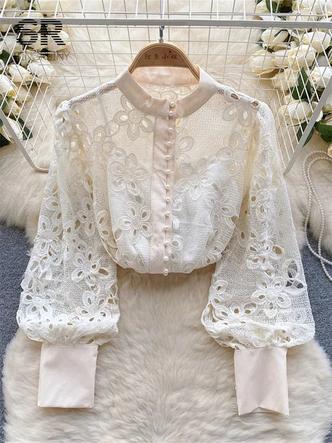 Blusa de primavera suelta y elegante con mangas farol huecas