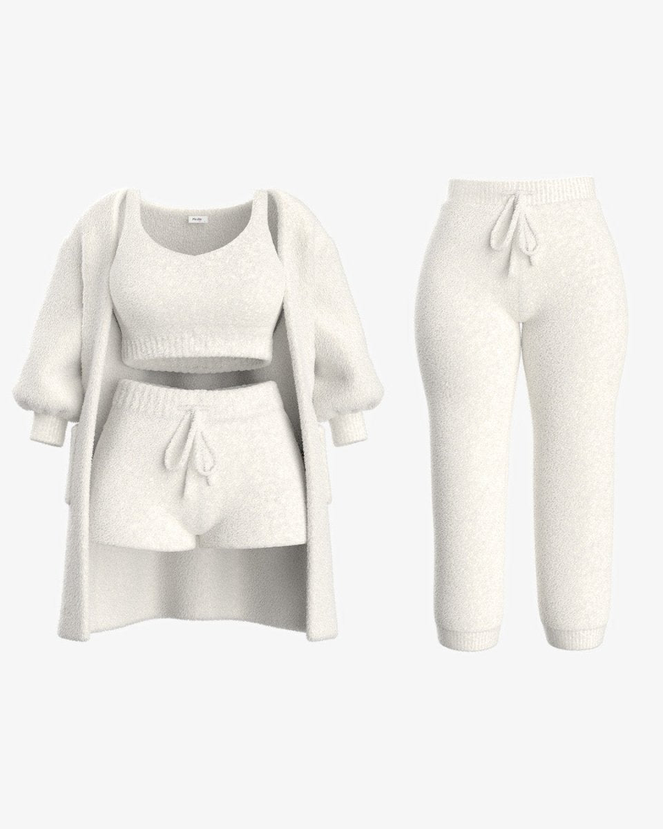 Witte fleece set bestaande uit een top, trui en broek, ontworpen voor ultieme warmte en comfort."