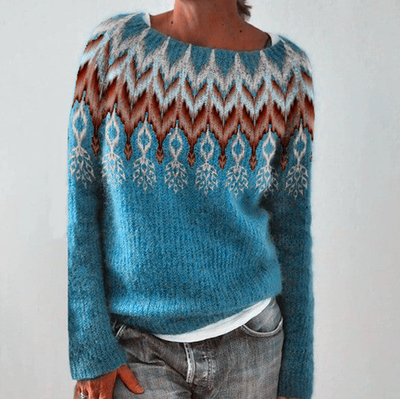 Zemara pullover in een prachtige blauw- en oranje gekleurde fair isle patroon, met een moderne en stijlvolle uitstraling, perfect voor koudere seizoenen.