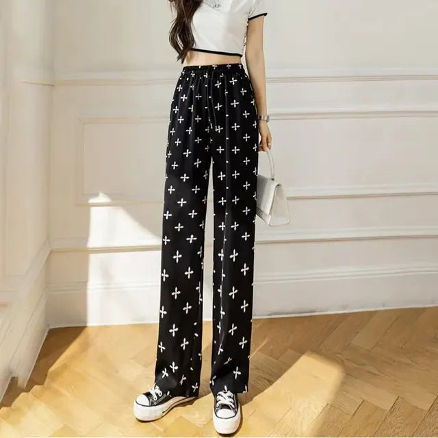 Pantalones acampanados de talle alto a rayas monocromáticas de Luna Stijl