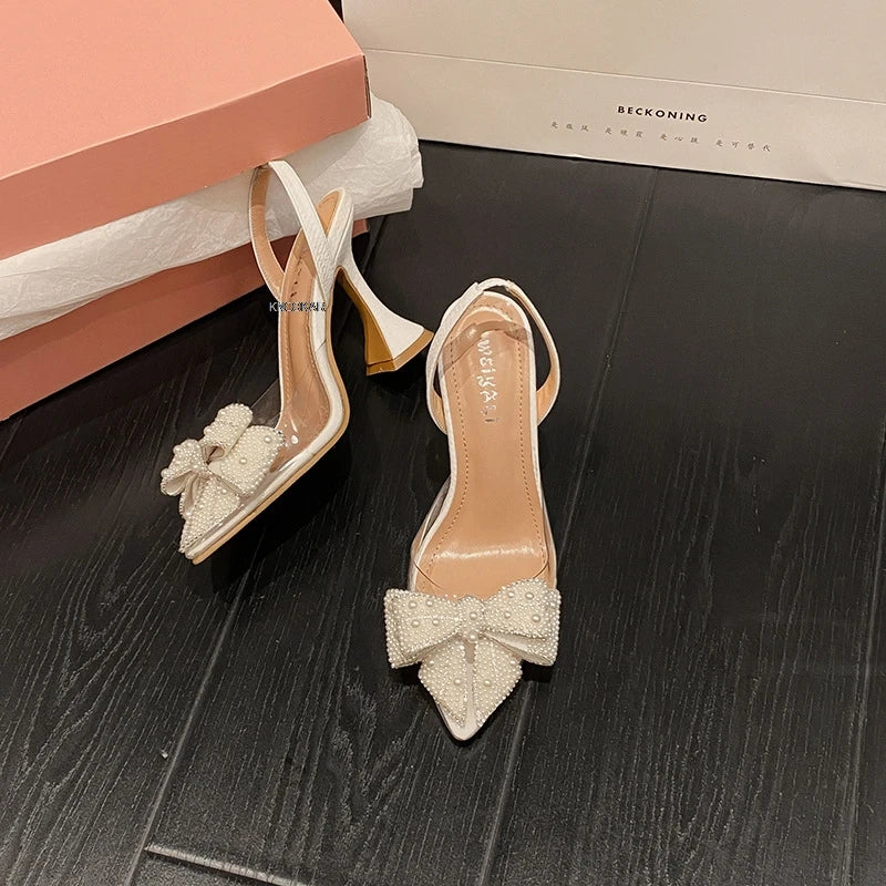 Radiant Summer Pearl Bow Sandals by Carmella