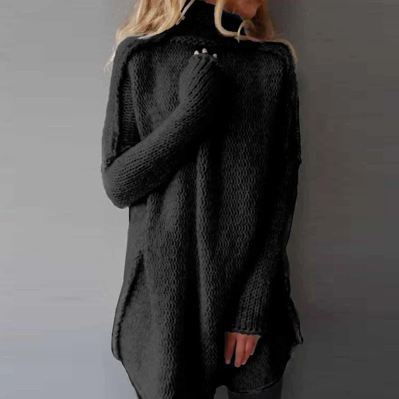 Belenza comfortabele trui in zwart, met een oversized pasvorm en een hoog opstaande kraag. De trui heeft een grove gebreide textuur en lange mouwen voor een warme en stijlvolle uitstraling. Perfect voor casual en cosy winterlooks.