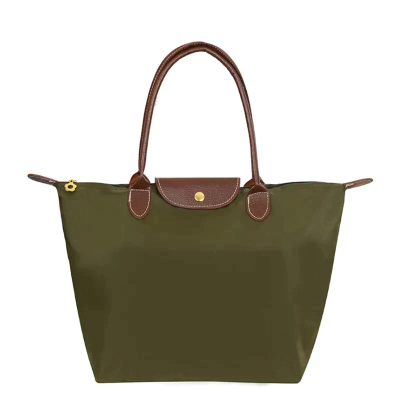 Berliani  Handtas Stijlvolle en ruime handtas in een elegante olijfgroene kleur. Gemaakt van waterafstotend materiaal met luxe bruine handvatten en een goudkleurige drukknoopsluiting. Perfect voor dagelijks gebruik met voldoende opbergruimte voor al je essentials.