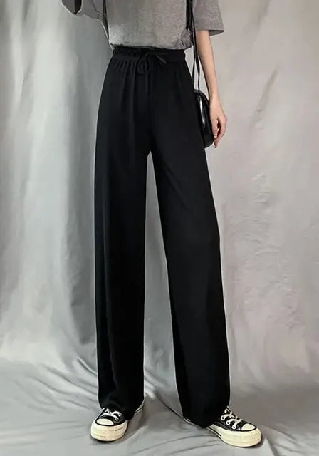 Pantaloni eleganti da donna con fondo a campana drappeggiato in seta ghiaccio e vita alta con gamba dritta
