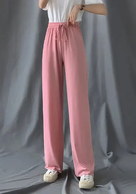 Pantaloni eleganti da donna con fondo a campana drappeggiato in seta ghiaccio e vita alta con gamba dritta