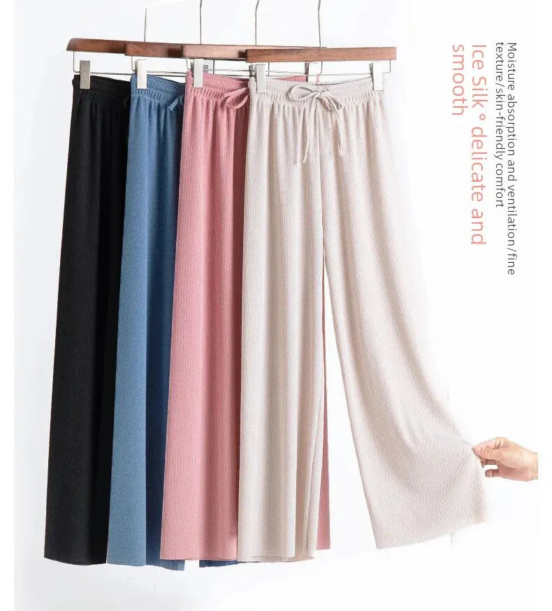Pantaloni eleganti da donna con fondo a campana drappeggiato in seta ghiaccio e vita alta con gamba dritta