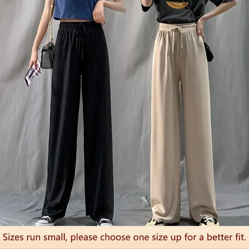Pantaloni eleganti da donna con fondo a campana drappeggiato in seta ghiaccio e vita alta con gamba dritta