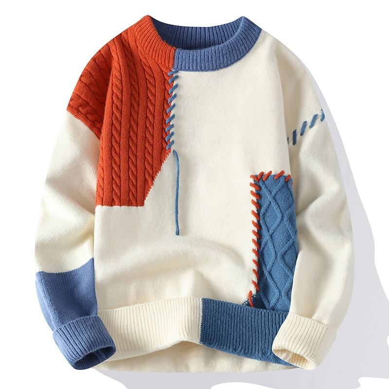 Frostina comfortabele sweater in crème, versierd met kleurrijke kabelpatronen in oranje en blauw voor een modern en stijlvol effect.