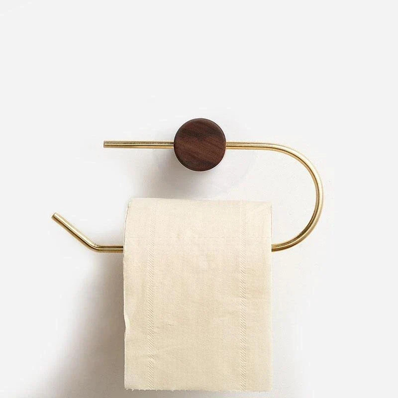 Harmano toiletrolhouder met een elegant en minimalistisch ontwerp. De houder is gemaakt van goudkleurig metaal en heeft een ronde houten accent. Een toiletrol hangt netjes op de houder, wat zorgt voor een stijlvolle en praktische toevoeging aan de badkamer of toiletruimte.