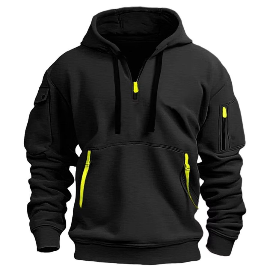 Zwarte Kendra Hoodie met gele ritsdetails en zakken met ritssluiting, een comfortabele en casual look.