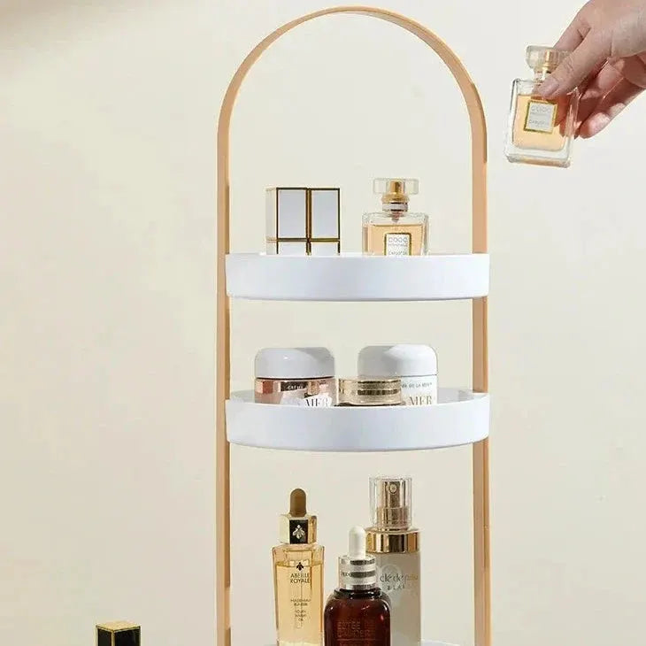 Luneva kosmetiek-organizer met drie lagen en een gouden boogvormig frame. Ideaal voor het overzichtelijk opbergen van parfums, crèmes en huidverzorging. Een chique en praktische toevoeging voor elke kaptafel of badkamer.