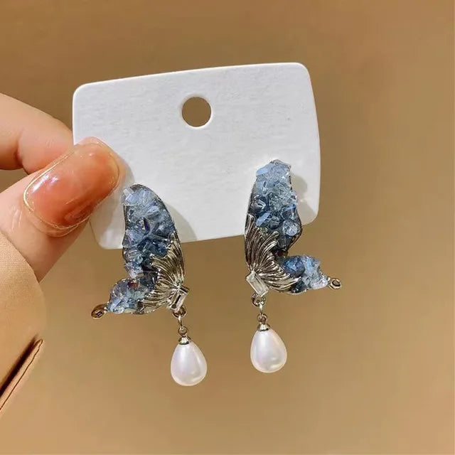 Orecchini a farfalla in rete cava bianco e nero eccentrici - Accessori eleganti vivaci