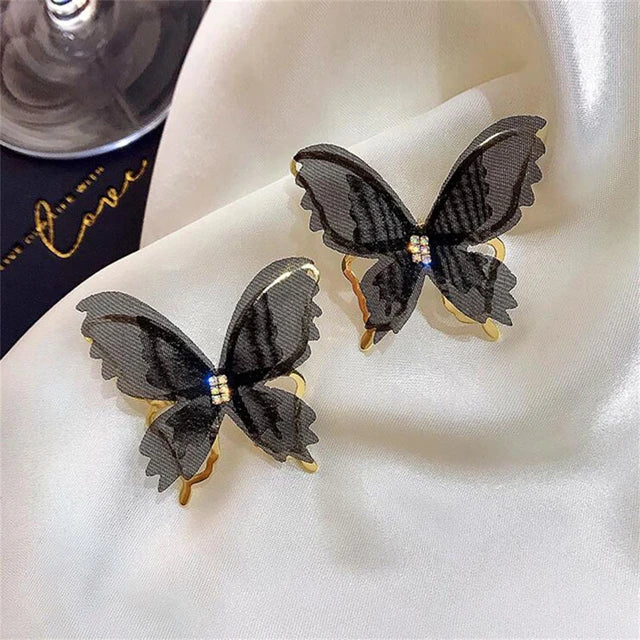 Orecchini a farfalla in rete cava bianco e nero eccentrici - Accessori eleganti vivaci