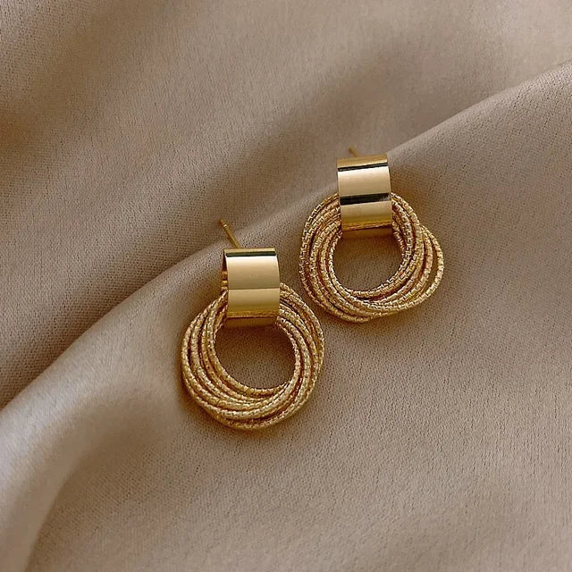 Enchanting Golden Circle Stud Earrings by Brilliant Creations