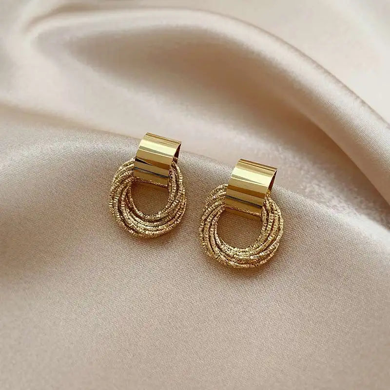 Enchanting Golden Circle Stud Earrings by Brilliant Creations