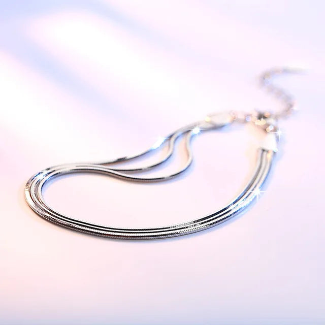 Bellissimo set di collane multiple a serpente e bracciale in argento