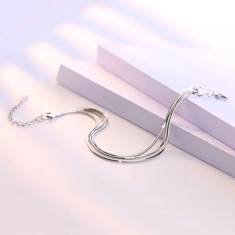 Bellissimo set di collane multiple a serpente e bracciale in argento