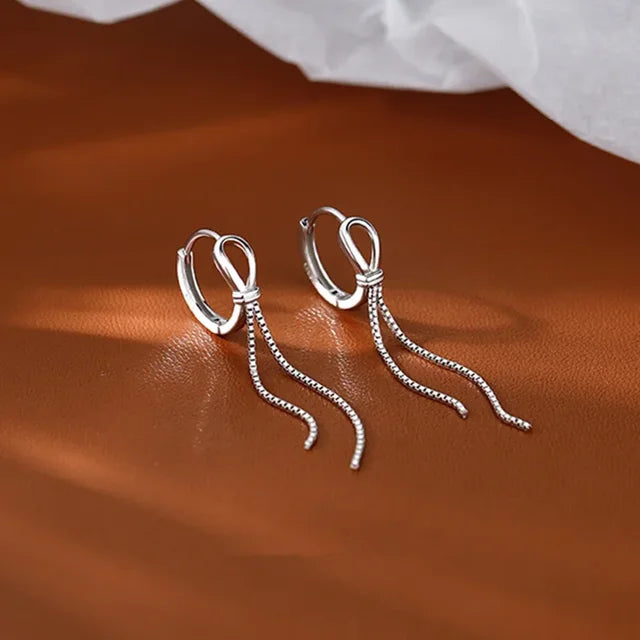 Voq Orecchini con Nappine Intrecciate Argento