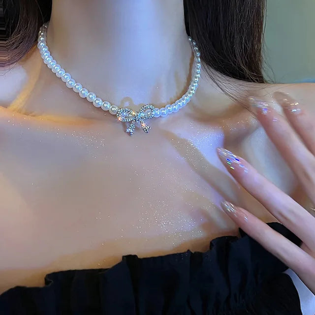Collana doppia Nova con fiocco e ciondolo a cuore