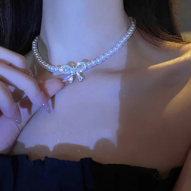 Collana doppia Nova con fiocco e ciondolo a cuore
