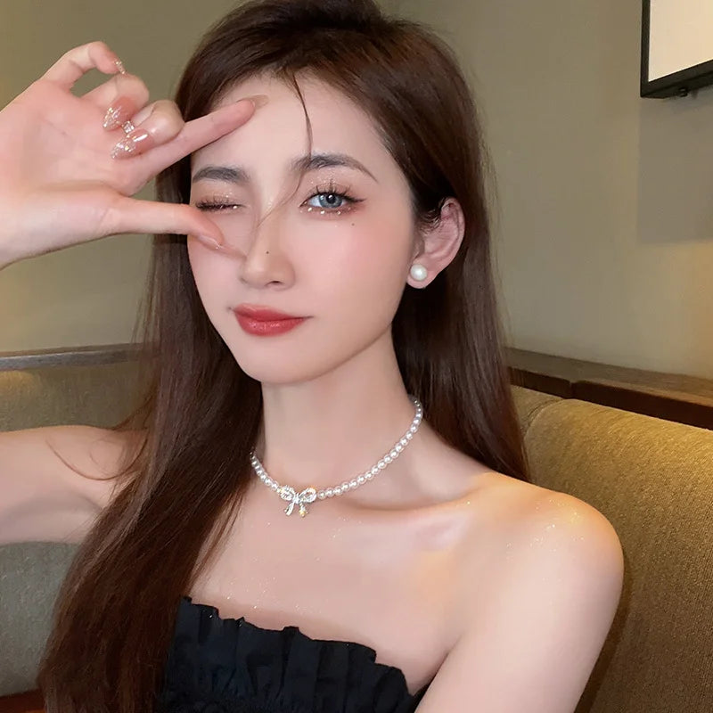 Collana doppia Nova con fiocco e ciondolo a cuore