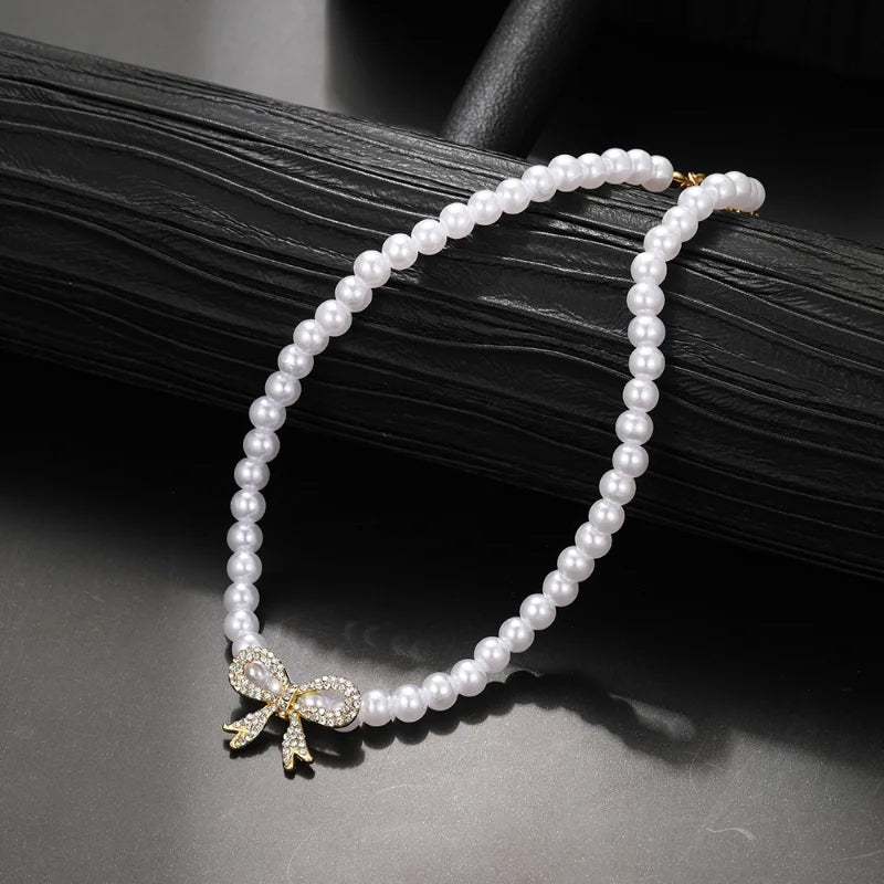 Collana doppia Nova con fiocco e ciondolo a cuore