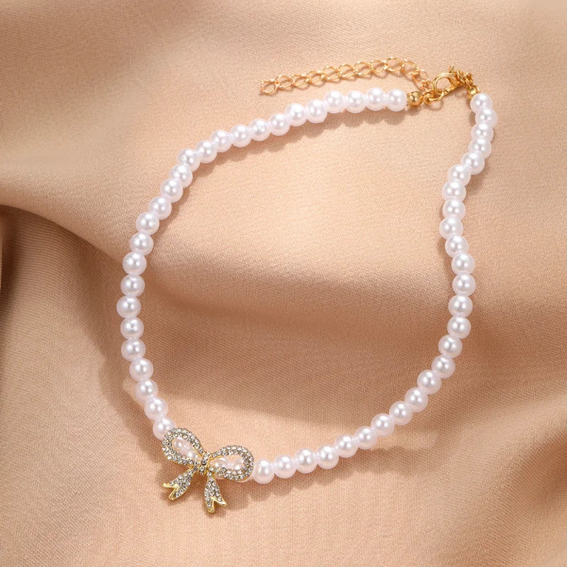 Collana doppia Nova con fiocco e ciondolo a cuore