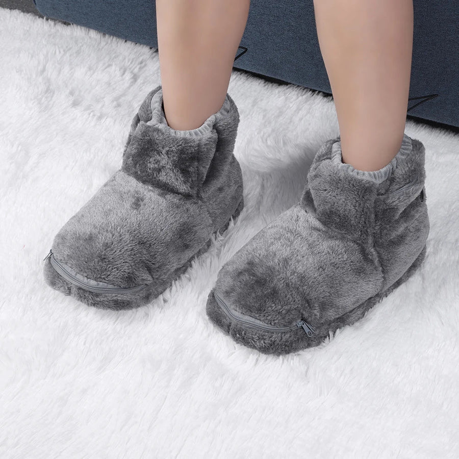 Zennor zip schoenen in grijze kleur, gemaakt van zacht en warm materiaal. De schoenen hebben een ritssluiting aan de voorkant voor eenvoudig gebruik en bieden maximaal comfort en stijl voor thuisgebruik. Perfect voor koude dagen.
